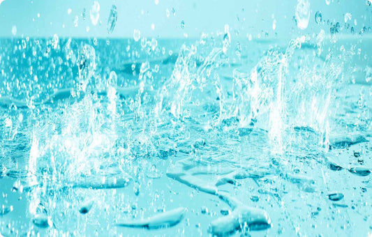 splashing water on a reflective mirror